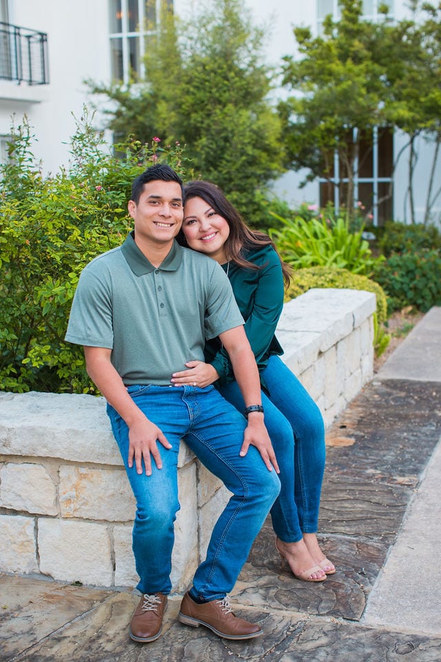 Anthony Engagement session at La Cantera Resort on the rock wall in green