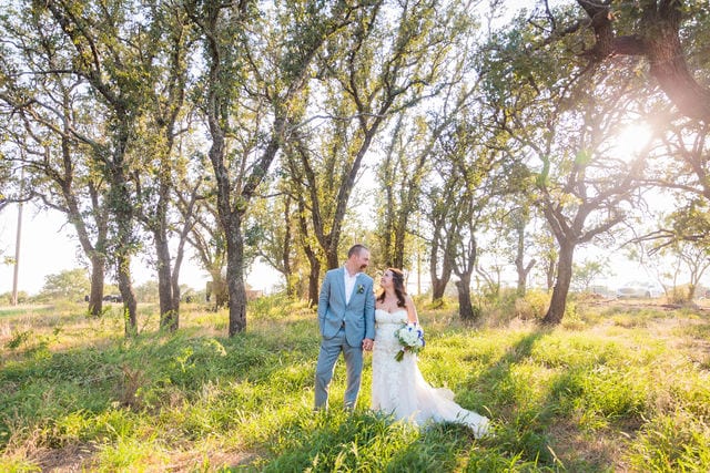 Keely's wedding in Mason TX, wide shot of the couple at sunset