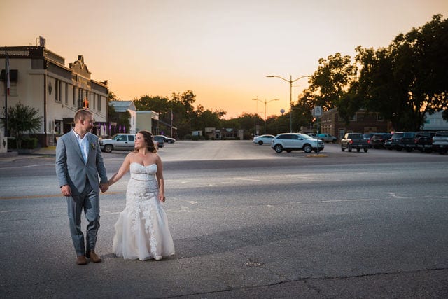 Keely's wedding in Mason TX, wide shot of the couple at sunset downtown