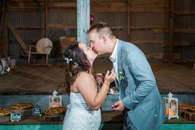 Keely's wedding in Mason TX, cake kiss