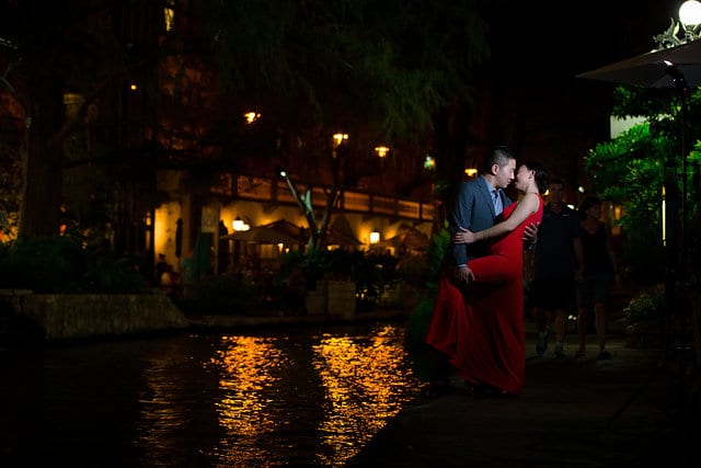 Sarah and Ming's Engagement Kiss at the riverwalk