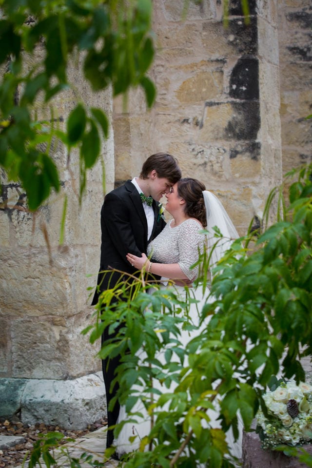 Allison wedding downtown San Antonio San Fernando Cathedral couple though the trees