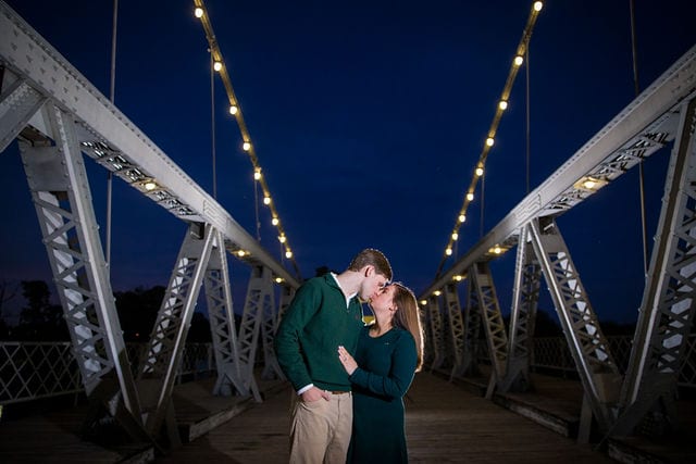 Allison's engagement Baylor University on the bridge in Waco night on bridge kiss