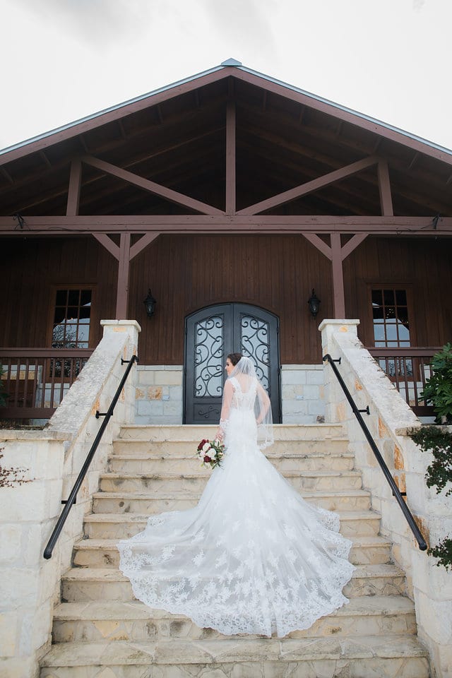 Amberlynn's bridal at The Milestone New Braunfels back of dress on the stair case side look