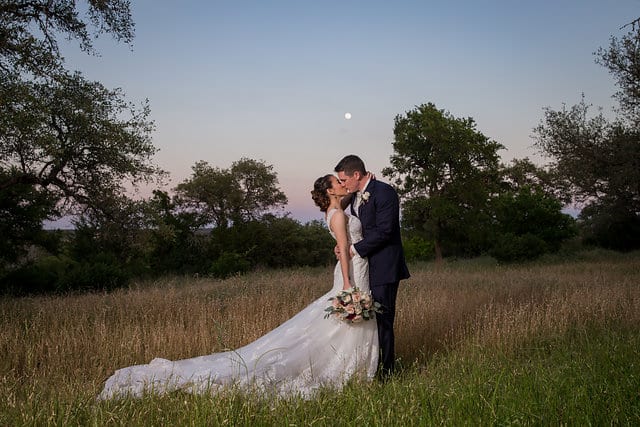 Amberlynn's wedding at The Milestone New Braunfels couple portrait with the moon kiss