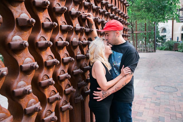 Chantel's engagement session at the Pearl by the sculpture kissing