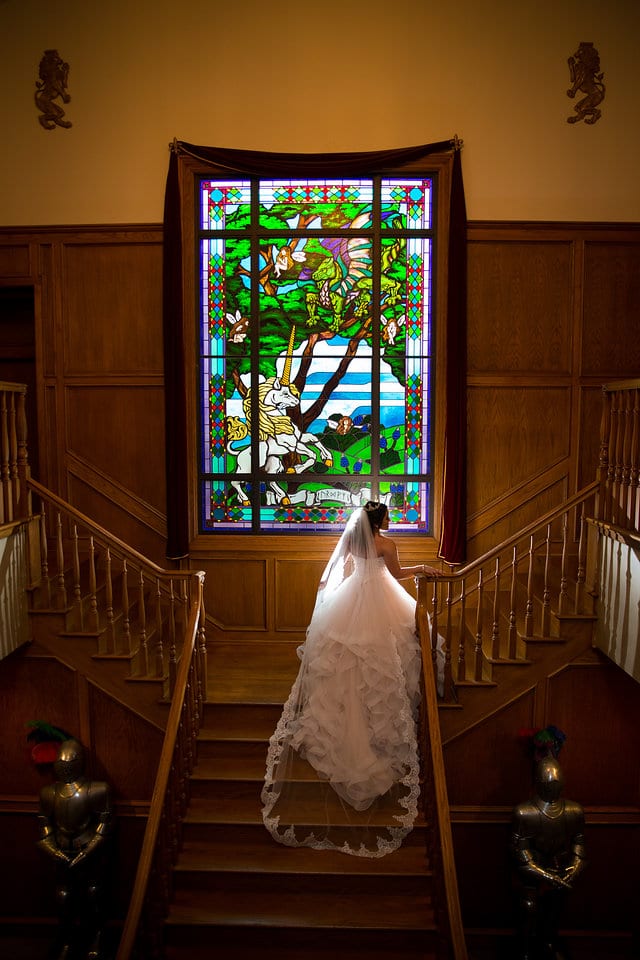 Emilia's Bridal in the ballroom at Castle Avalon on the full staircase back light