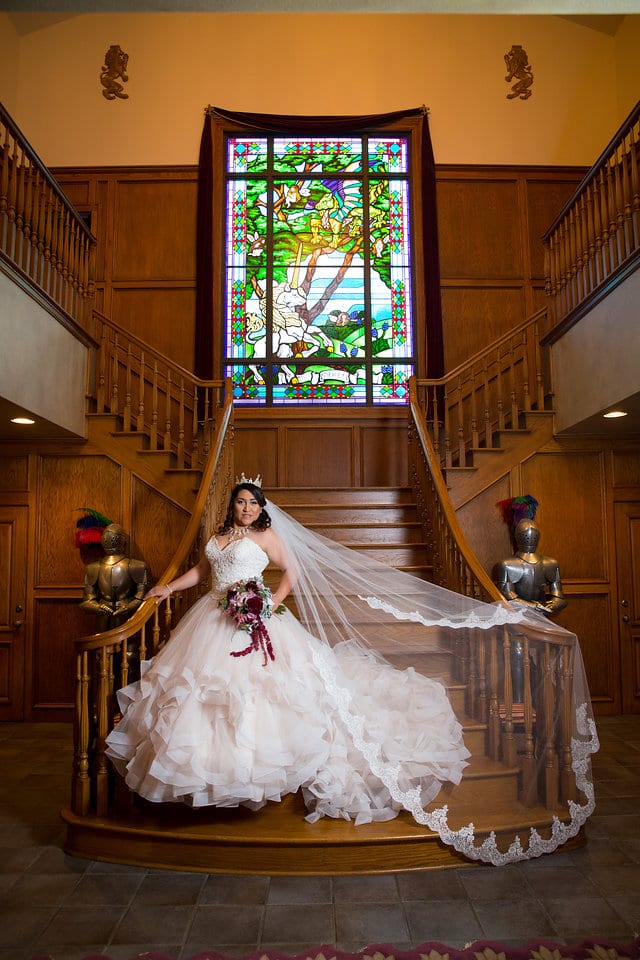 Emilia's Bridal in the ballroom at Castle Avalon traditional staircase portrait