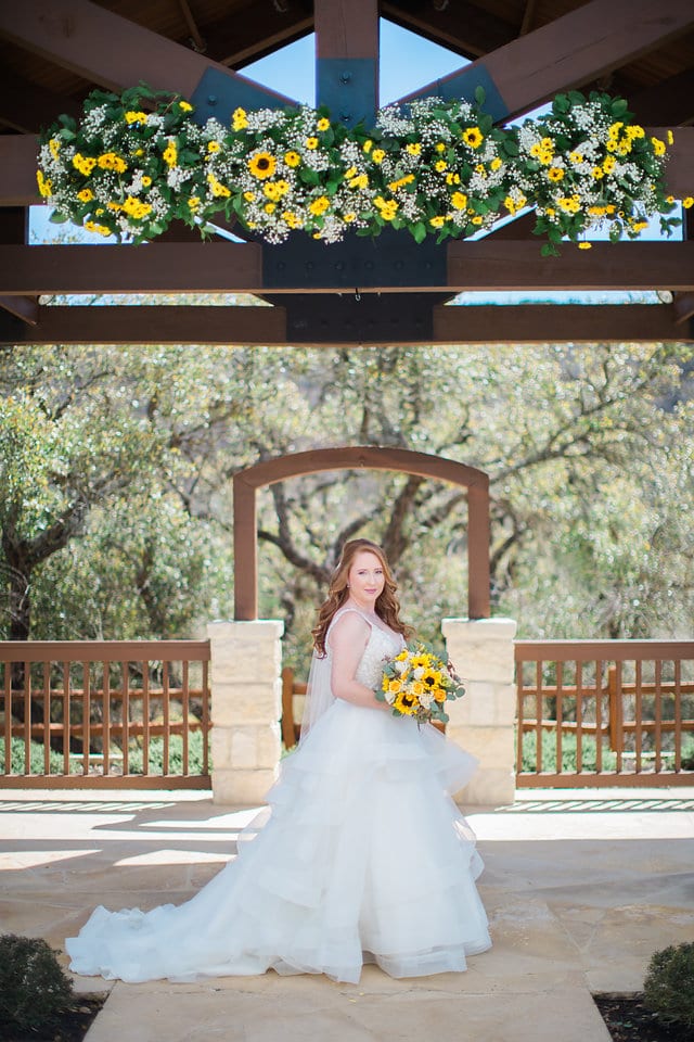 Jamie's Bridal at the Milestone in Boerne portrait at the gazebo with flowers