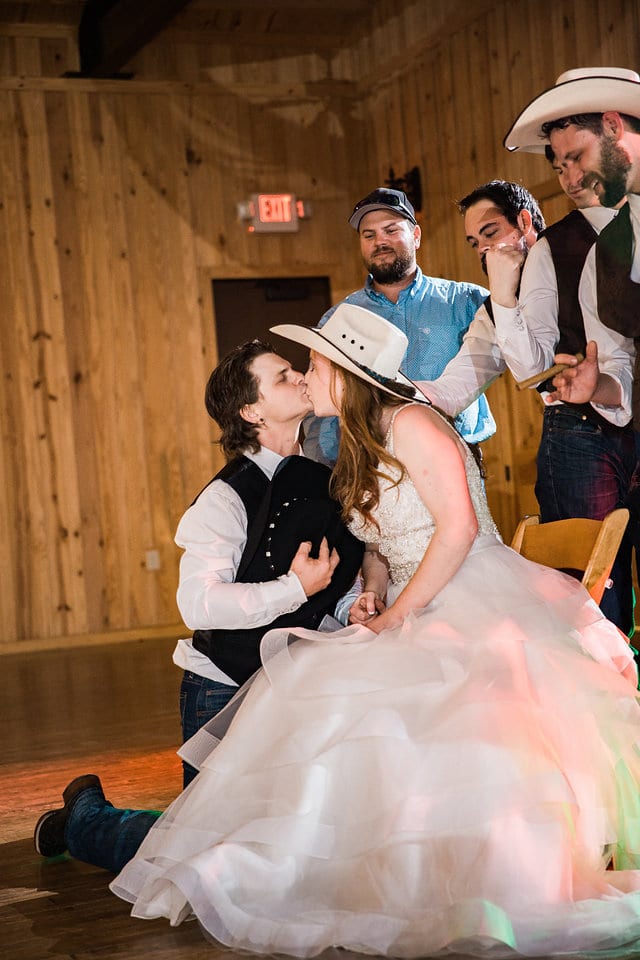 Jamie's wedding at the Milestone in Boerne reception garter kiss