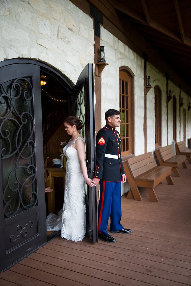 Katie Z wedding at tThe Milestone New Braunfels bride and groom first look back to the doors