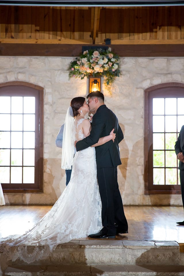 Katie Z wedding at tThe Milestone New Braunfels ceremony kiss