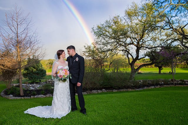 Katie Z wedding at tThe Milestone New Braunfels the bride and groom with rainbow landscape