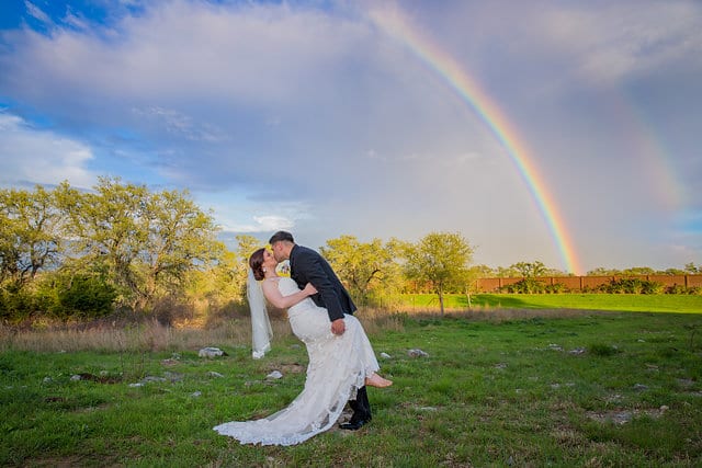 Katie Z wedding at tThe Milestone New Braunfels the bride and groom with rainbow dip