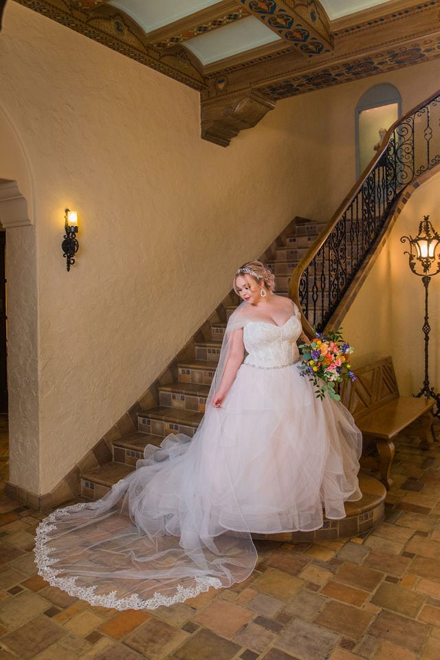 Katie's Bridal session at the McNay posed at the bottom of the stair case