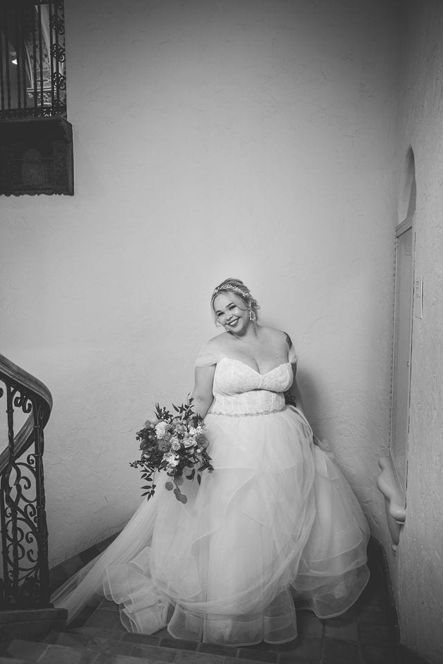 Katie's Bridal session at the McNay posed at the top of the stairs in black and white.