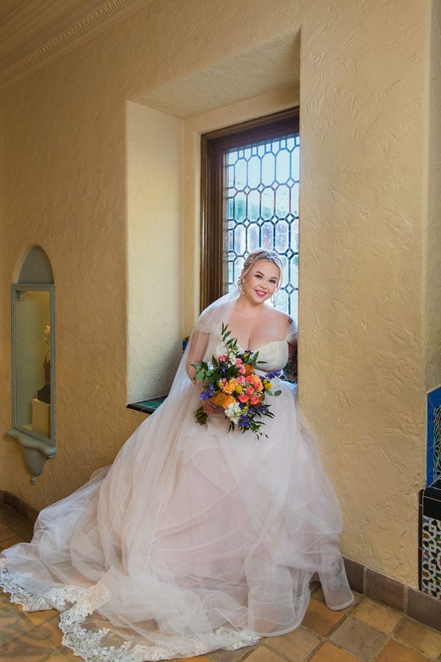 Katie's Bridal session at the McNay posed in the window