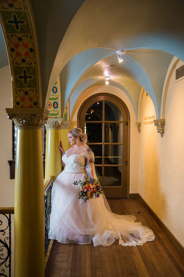 Katie's Bridal session at the McNay standing in the gallery looking out