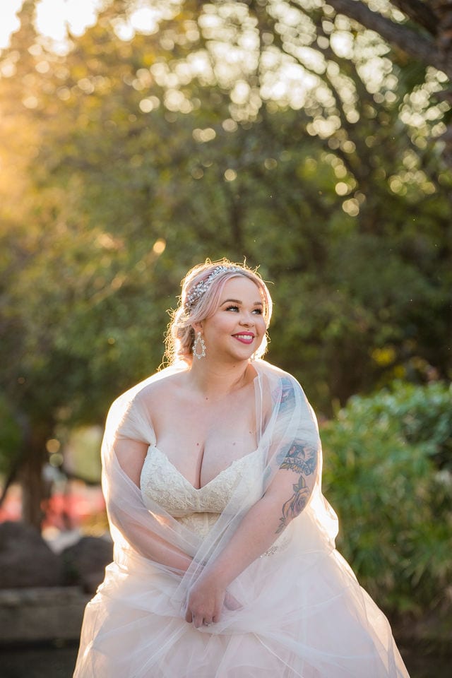 Katie's Bridal session at the McNay stone bridge wrapped in the veil