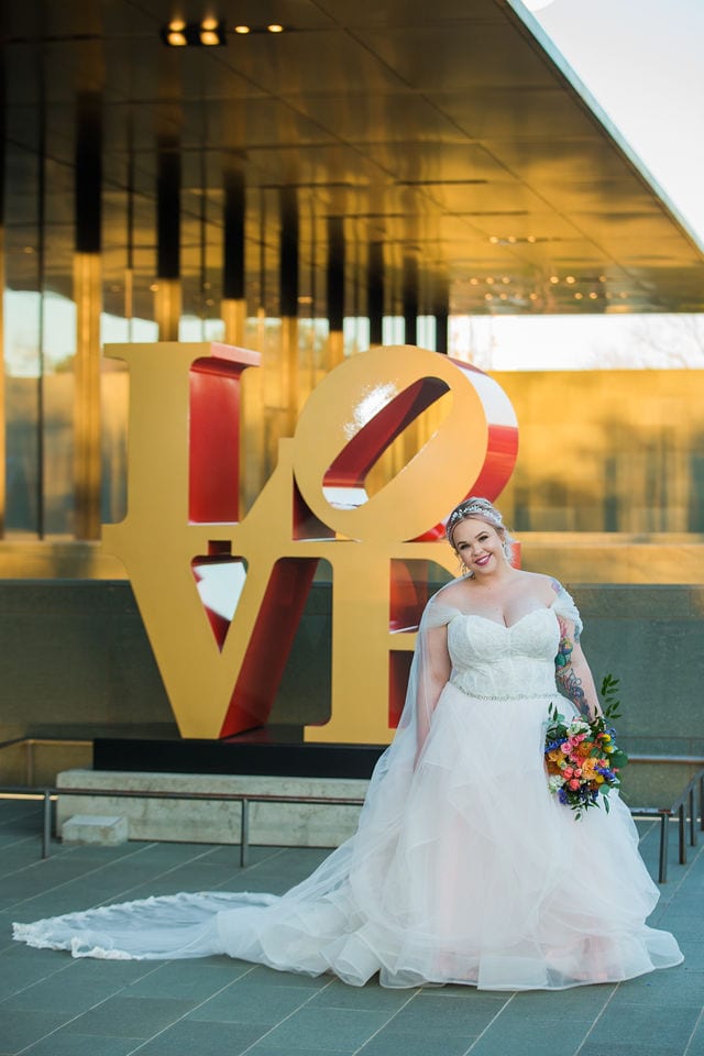 Katie's Bridal session at the McNay walking with the LOVE sign