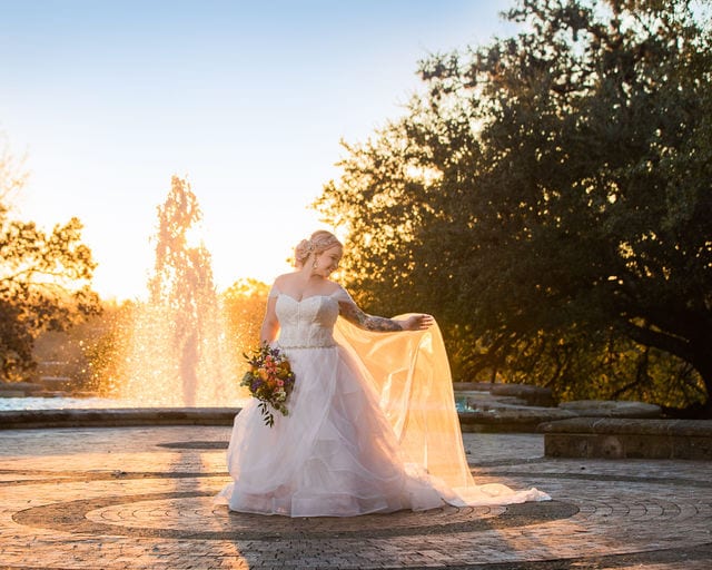Katie's Bridal session at the McNay golden sunset by the fountain looking back