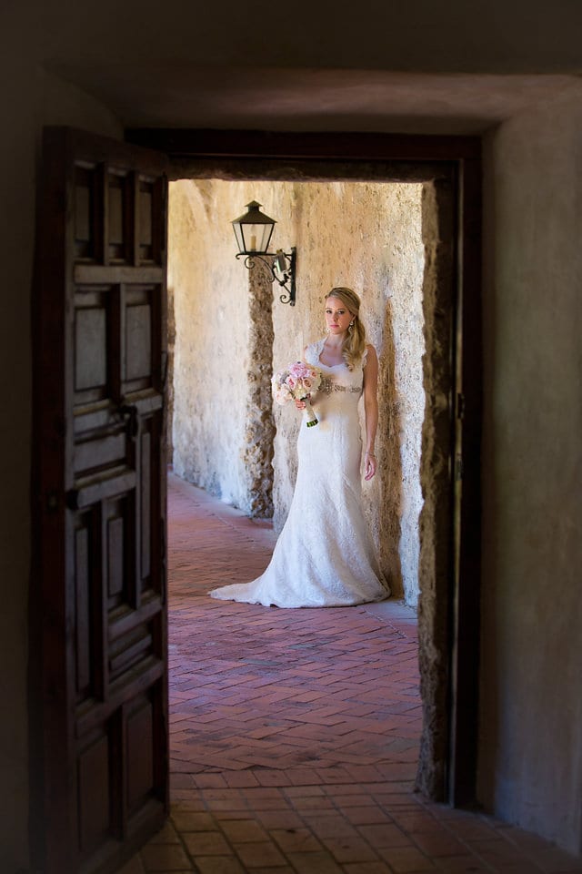 Kimb bridal at Mission Conception bridal portrait through the door