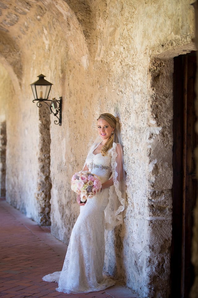 Kimb bridal at Mission Conception bridal leaning by the wall