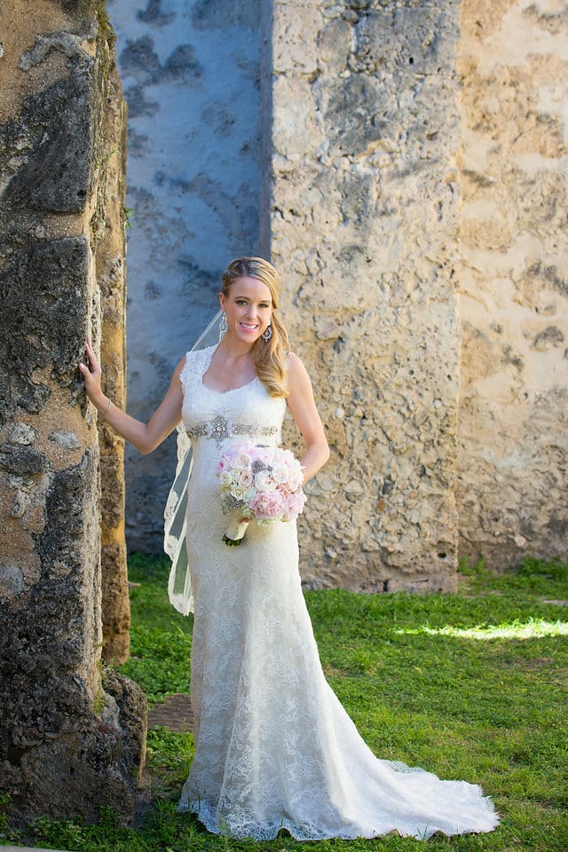 Kimb bridal at Mission Conception portrait the the grass with the wall