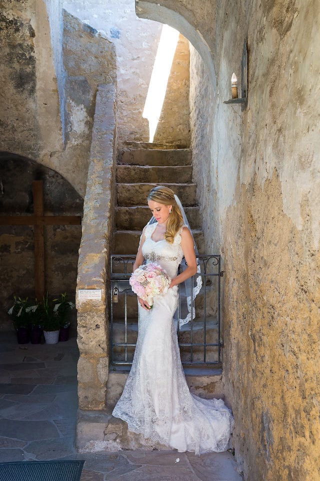 Kimb bridal at Mission Conception portrait by the gate looking down