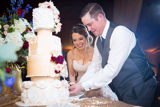 Victorias wedding Chandelier of Gruene bride and groom cake cutting