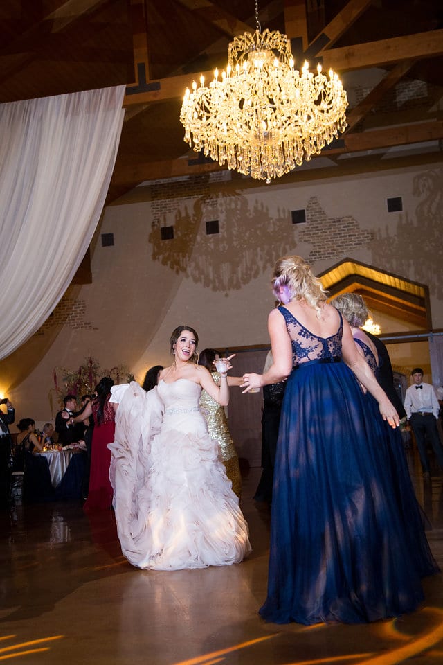 Victoria's wedding Chandelier of Gruene bride dancing at reception