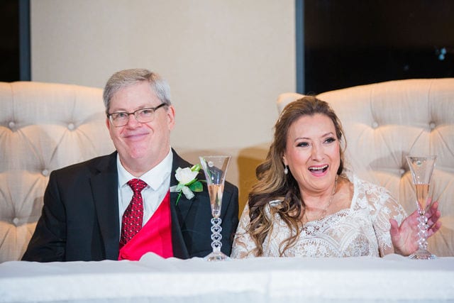 Linda and John's wedding at Silverhorn in San Antonio portrait wedding couple laughing at toast