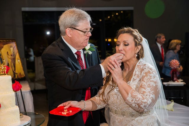 Linda and John's wedding at Silverhorn in San Antonio cake feeding 2