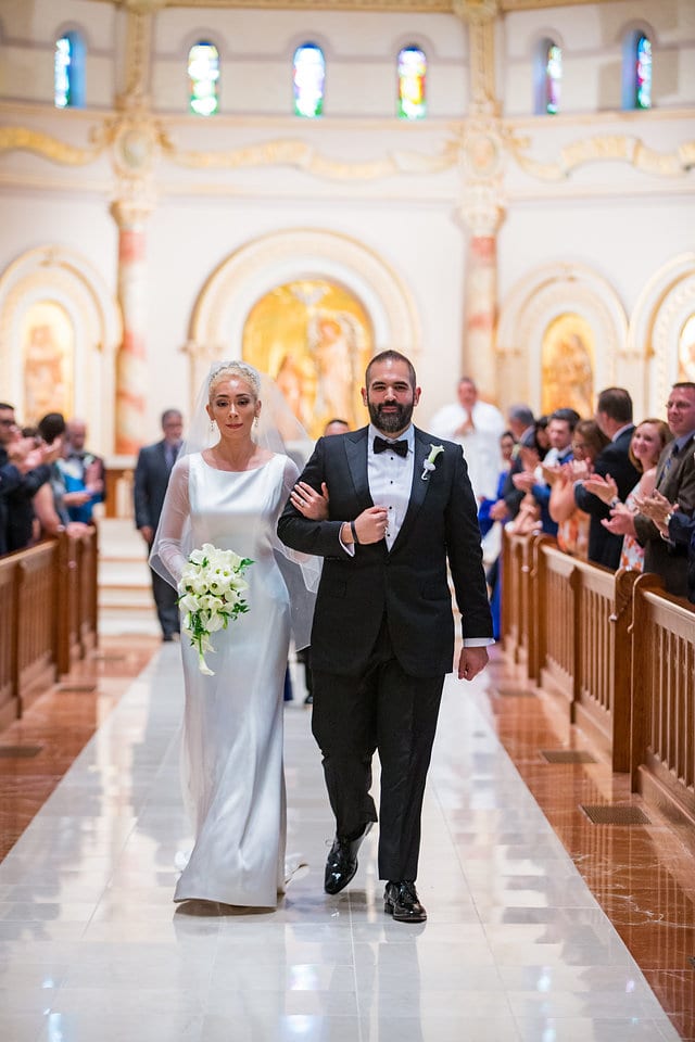 Nick and Liz wedding University of the Incarnate Word chapel COUPLE walking down aisle