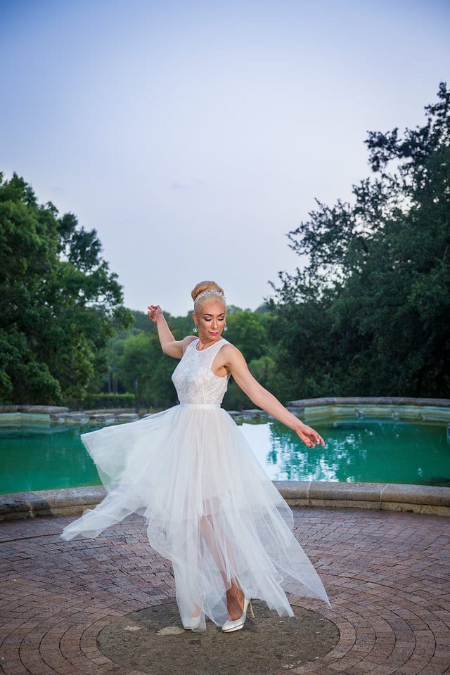 Nick and Liz wedding bride at the McNay Art Museum by fountain dancing