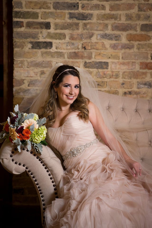 Victoria's bridal at The Chandelier of Gruene bridal suite on the sofa close up cute