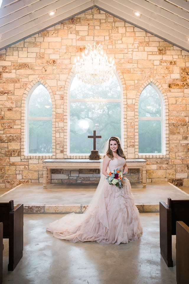 Victoria's bridal at The Chandelier of Gruene bride in the aisle