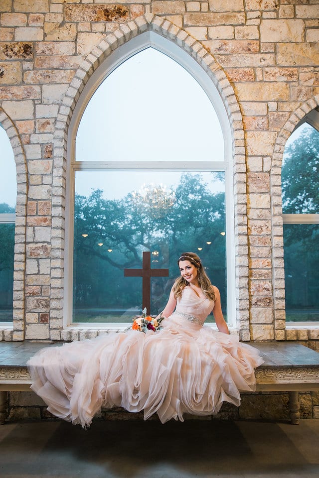 Victoria's bridal at The Chandelier of Gruene sitting in the chapel window