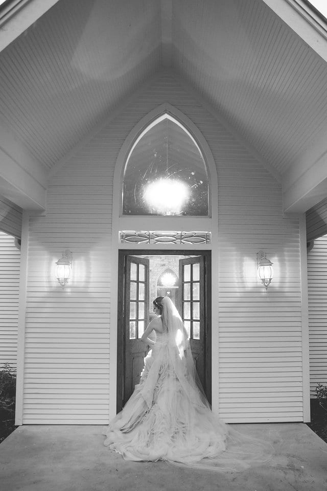 Victoria's bridal at The Chandelier of Gruene portrait in the doors black and white