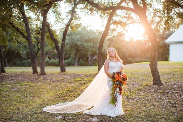 Whitney's Bridal portrait the Chandelier of Gruene in the trees at sunset bright