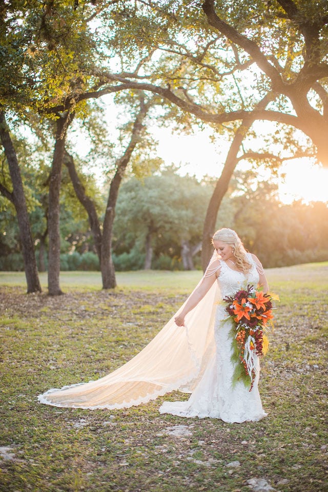 Whitney's Bridal portrait the Chandelier of Gruene in the trees at sunset with veil