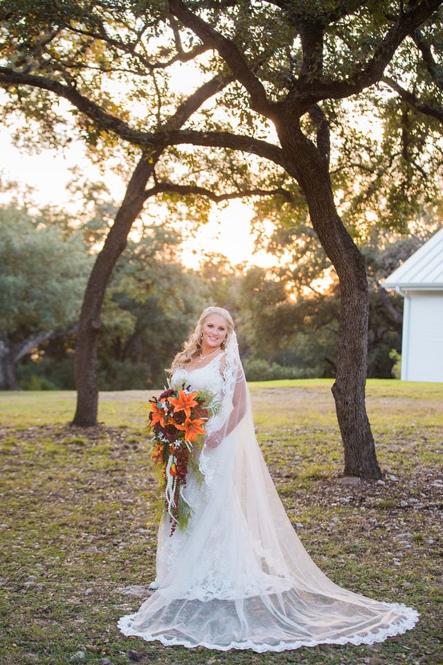 Whitney's Bridal portrait the Chandelier of Gruene in the trees at sunset