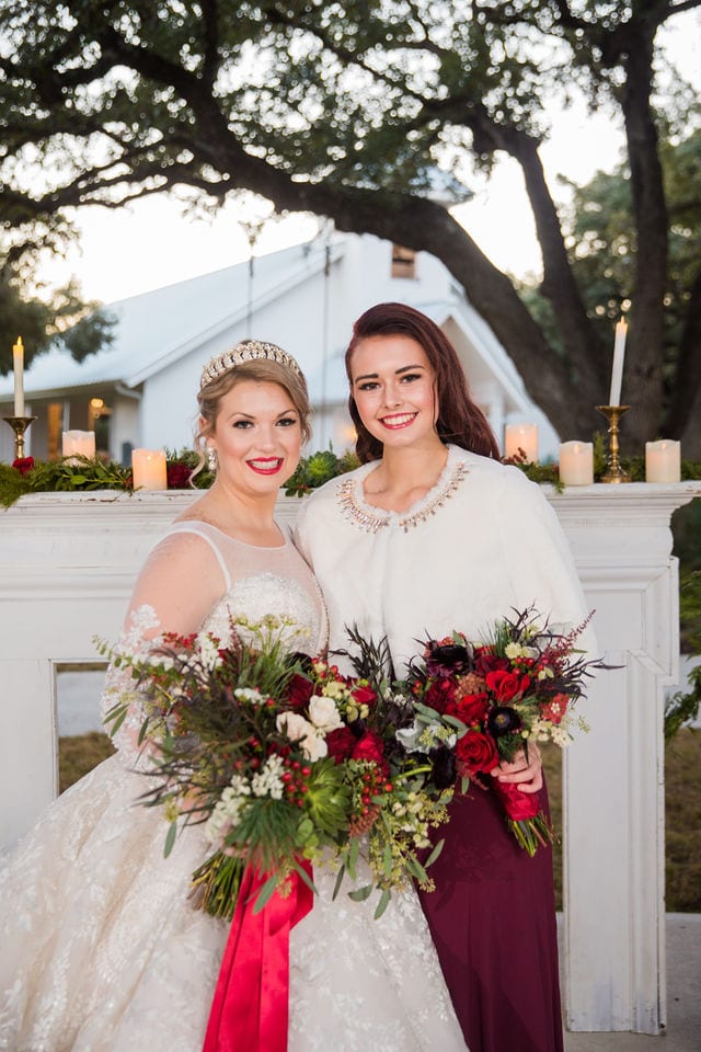 Styled shoot Chandelier of Gruene Christmas bride and bridesmaid