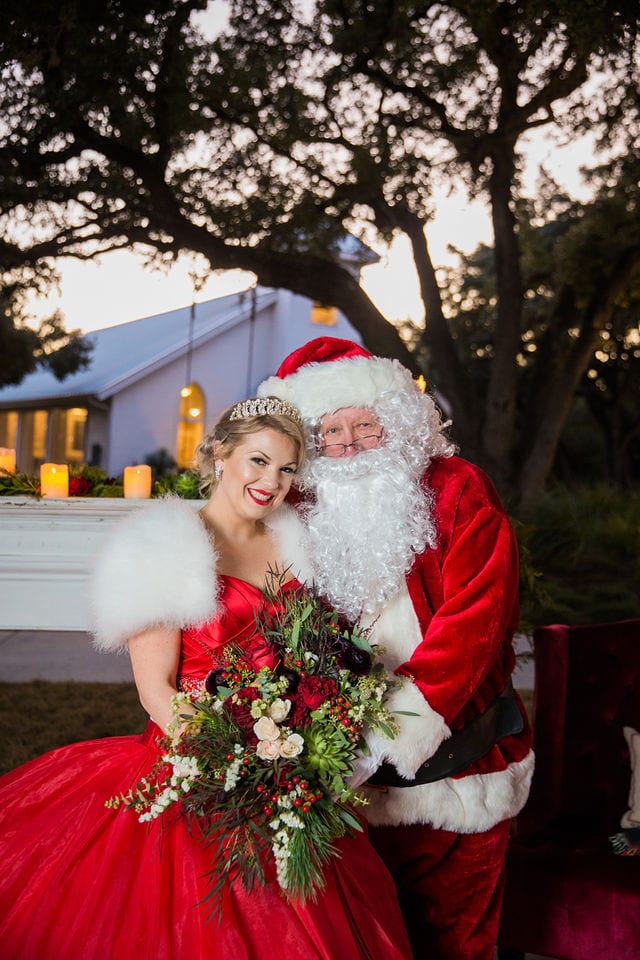Styled shoot Chandelier of Gruene Christmas bride in red with Santa