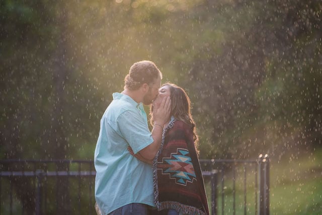 Hand engagement in the blanket raining kiss