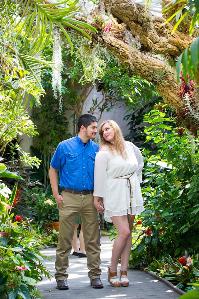 Cantu engagement couple on the bridge San Antonio Botanical Garden tropical atrium