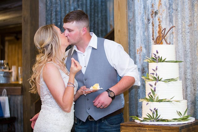 Chelsea and Tyler's Wedding, bride and groom kiss after cake cutting