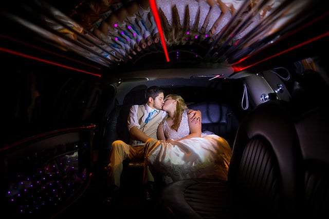Cassie and John wedding Hidden Falls limo kiss