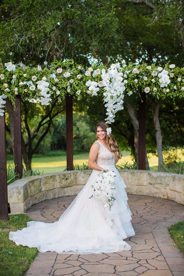 Styled wedding shoot at Olympia Hills San Antonio bride at the ceremony site laughing