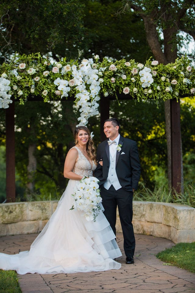 Styled wedding shoot at Olympia Hills San Antonio bride and groom at the ceremony site laughing